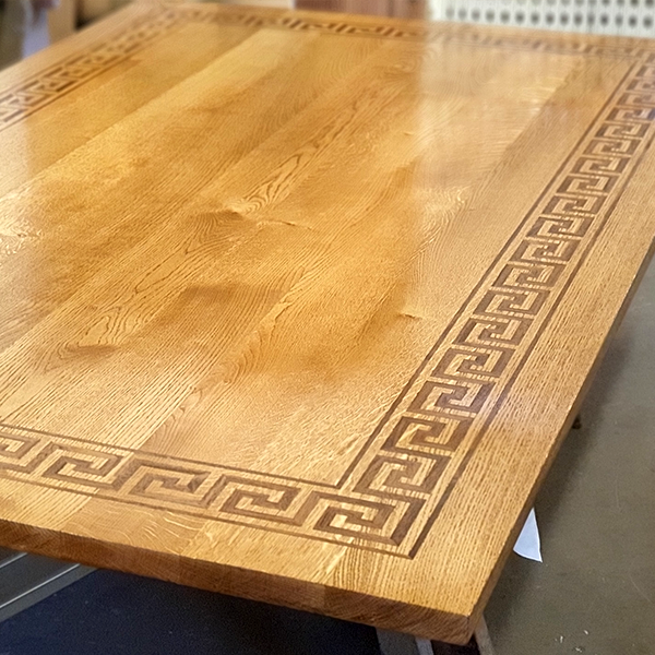 Greek key table with lacquer finish